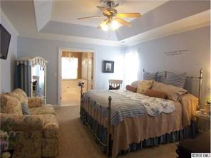 944 Knightsbridge Road Fort Mill, SC 29708 - Photo 9 of 16 a bedroom with a bed a ceiling fan and a dresser