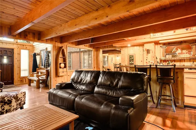 a living room with lots of furniture and a table