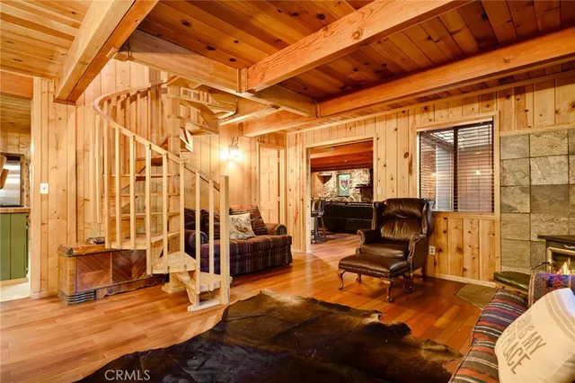 a view of a livingroom with couch and lounge chair