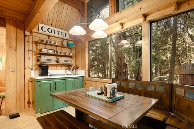 a view of kitchen with a table and chairs