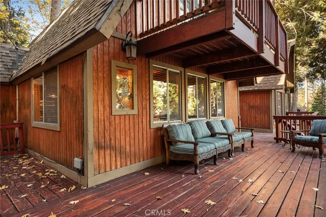 a view of patio with wooden floor and outdoor seating