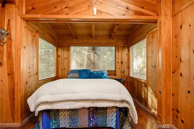 a bedroom with a bed and a table