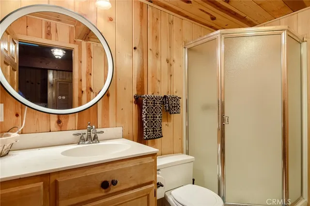 a bathroom with a sink a vanity and a mirror