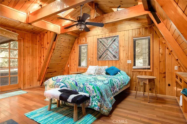 a bedroom with a bed and a fireplace