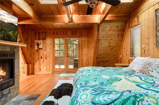 a bedroom with a bed and a fireplace