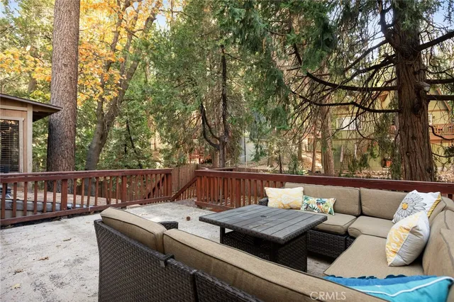 a view of a terrace with couches and a fire pit