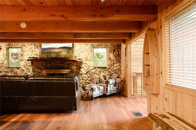 a view of a livingroom with furniture and an empty room