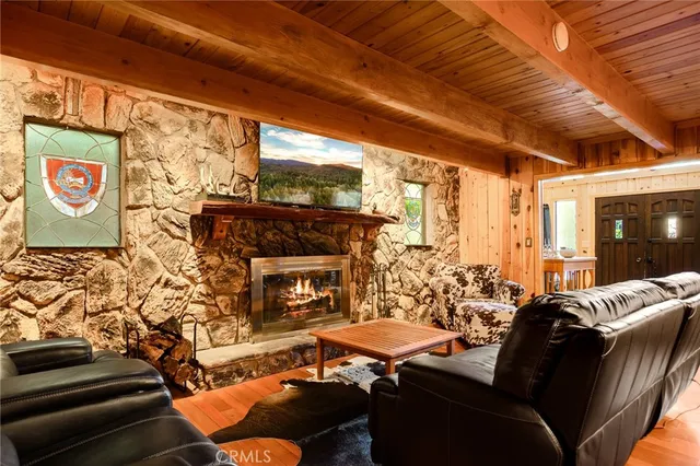 a outdoor living space with furniture and a fireplace