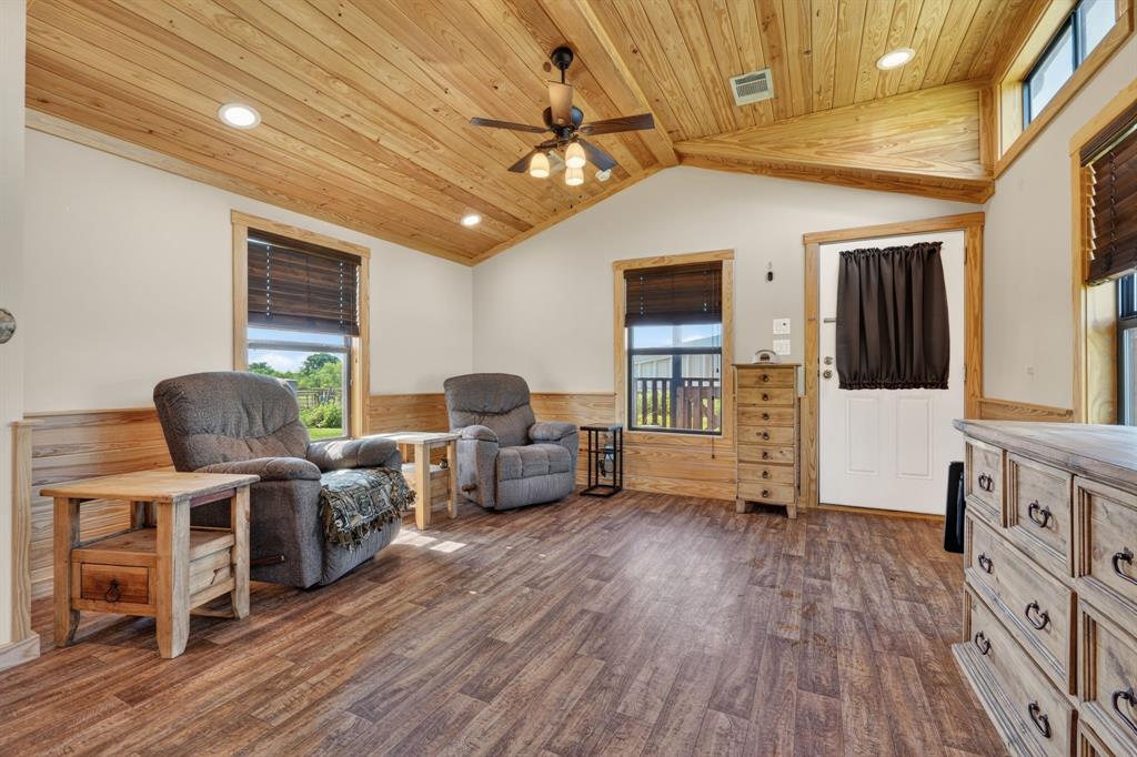 2401 Lamkin Road Mineral Wells, TX 76067 - Photo 9 of 36 a living room with furniture and a wooden floor