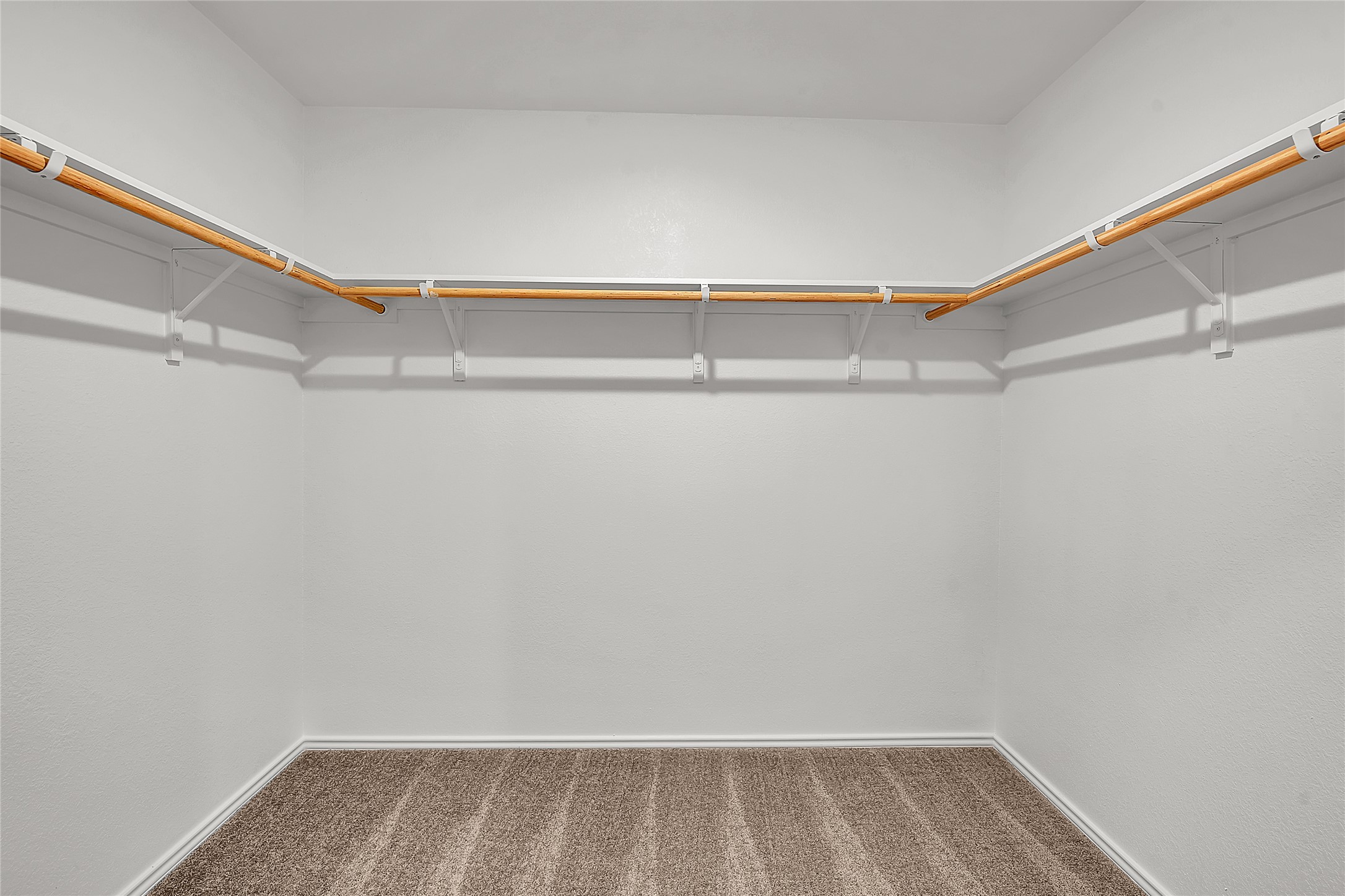 2528 Willkomen Way Manor, TX 78653 - Photo 11 of 21 a view of walk in closet with empty racks