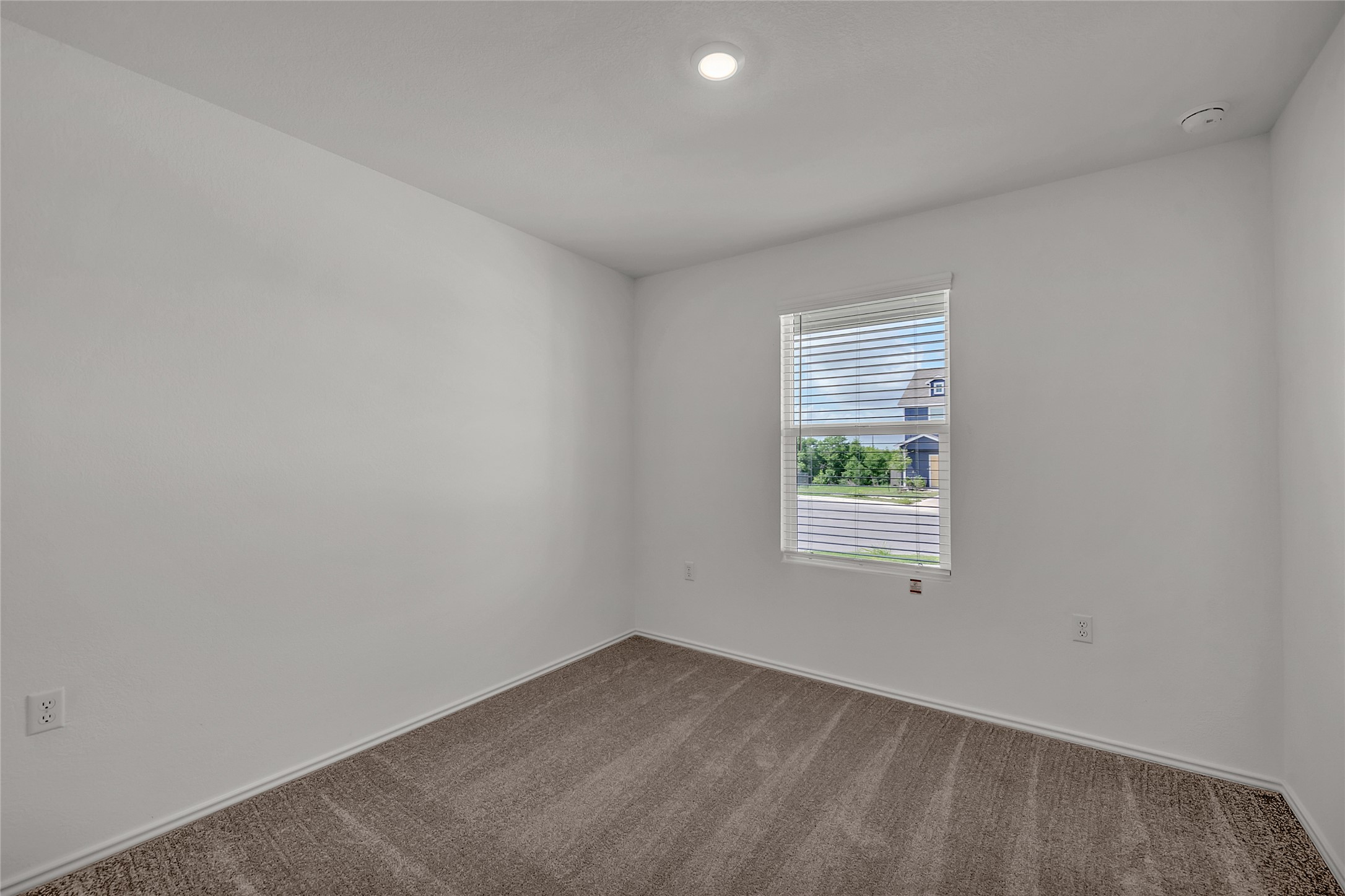 2528 Willkomen Way Manor, TX 78653 - Photo 12 of 21 an empty room with a window