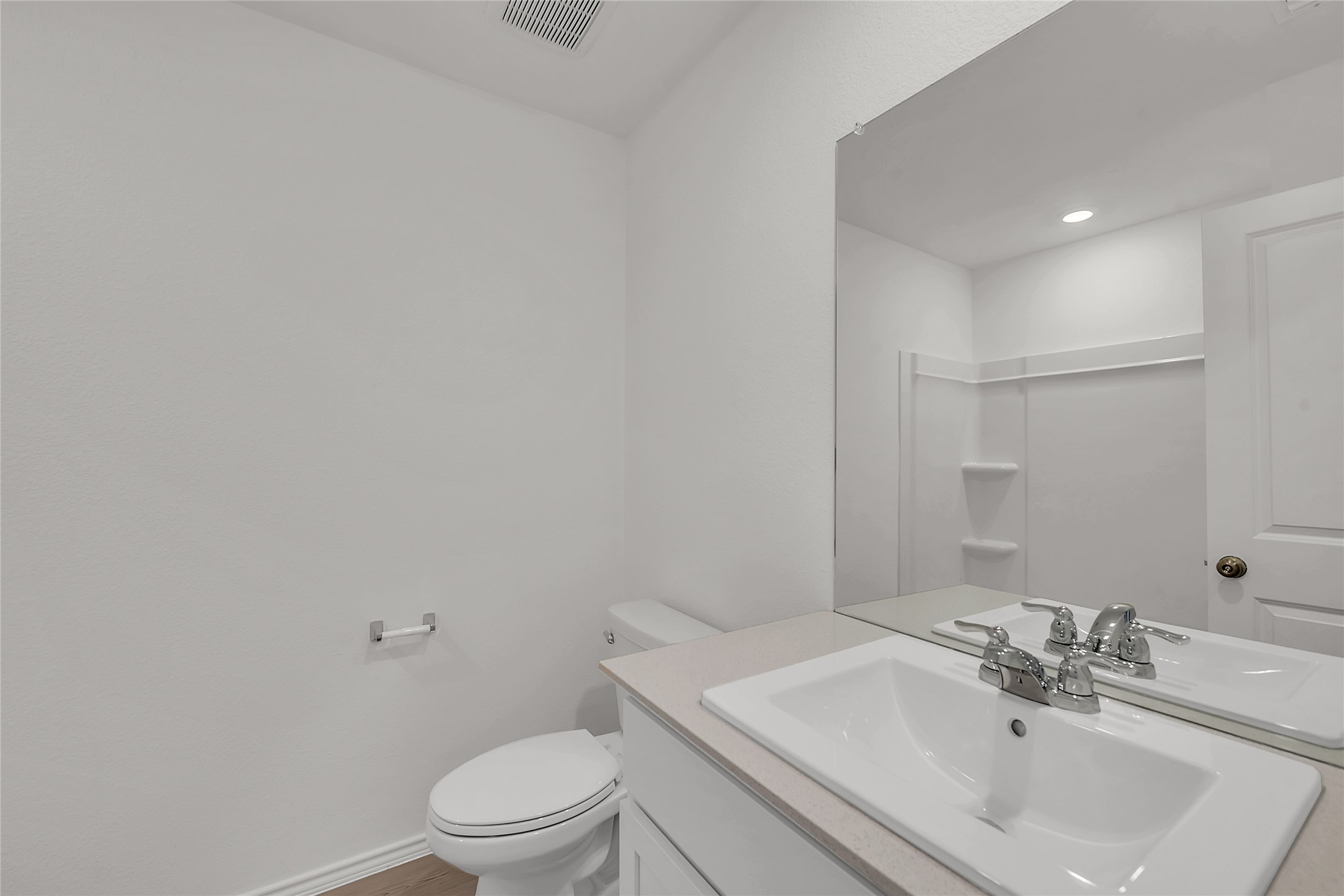 2528 Willkomen Way Manor, TX 78653 - Photo 13 of 21 a bathroom with a sink a toilet and a mirror