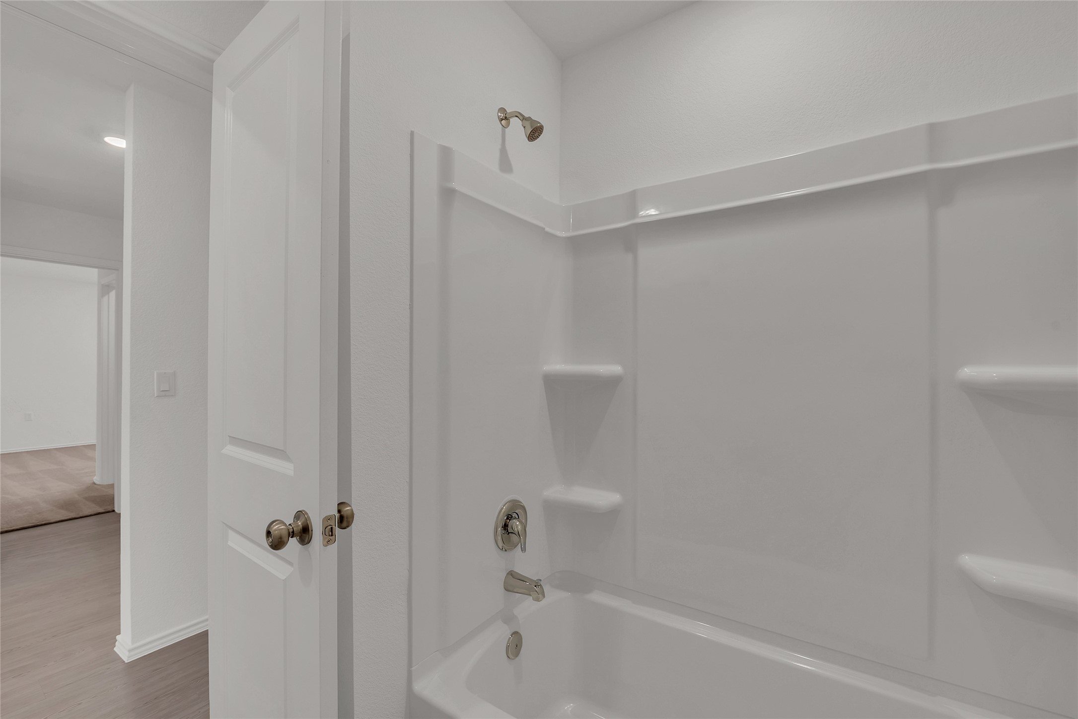 2528 Willkomen Way Manor, TX 78653 - Photo 14 of 21 a bathroom with a bathtub and shower