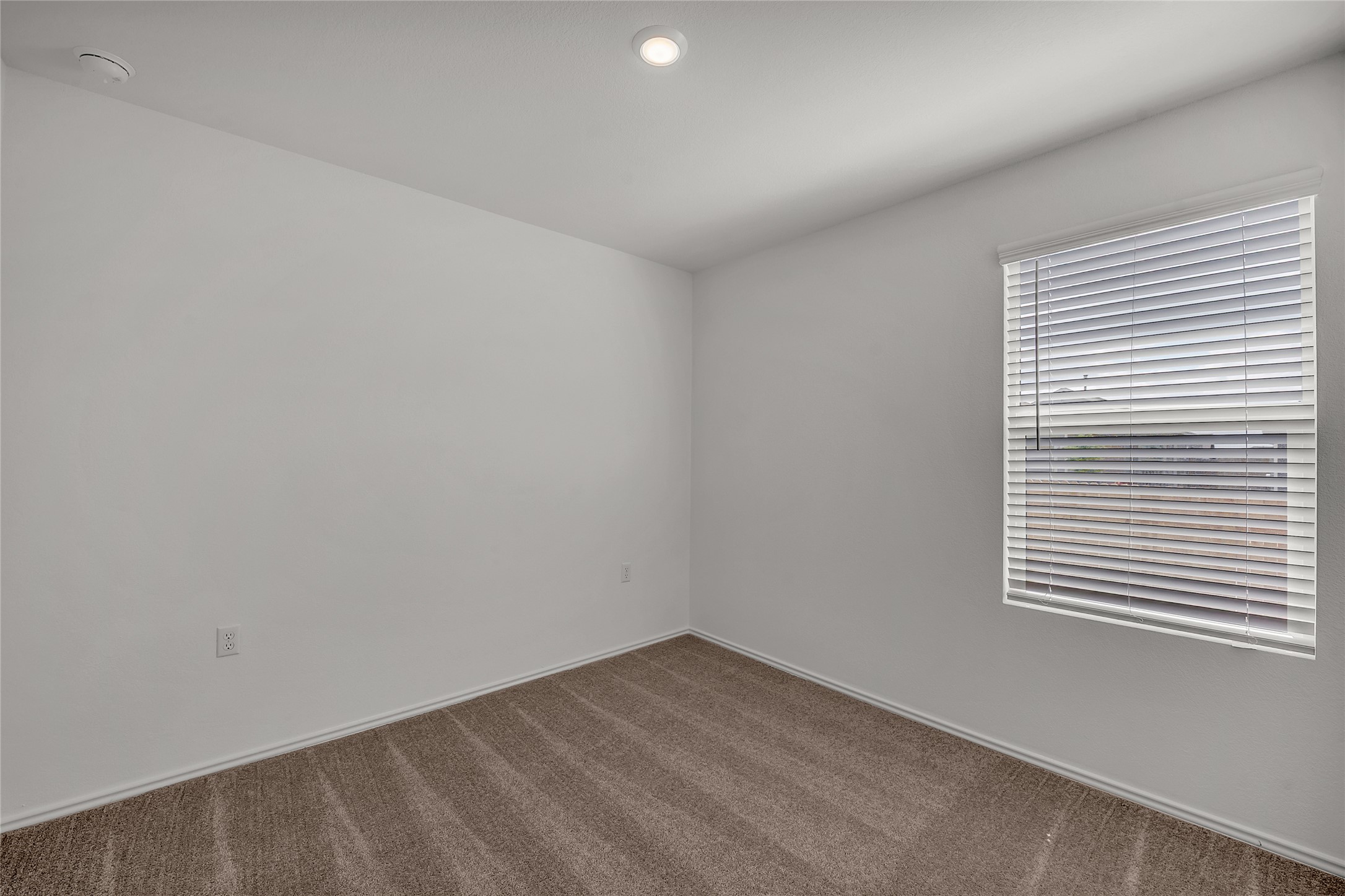 2528 Willkomen Way Manor, TX 78653 - Photo 15 of 21 an empty room with a window