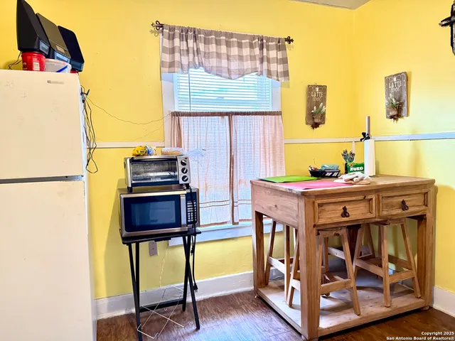 a kitchen with stainless steel appliances granite countertop a stove and a refrigerator