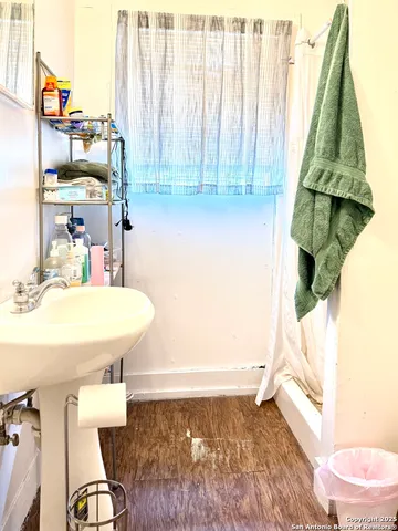 a bathroom with a sink toilet and tub
