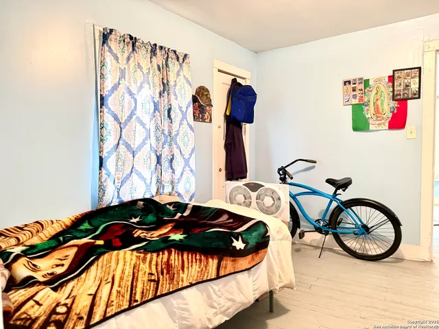 a bedroom with a bed and a table in it