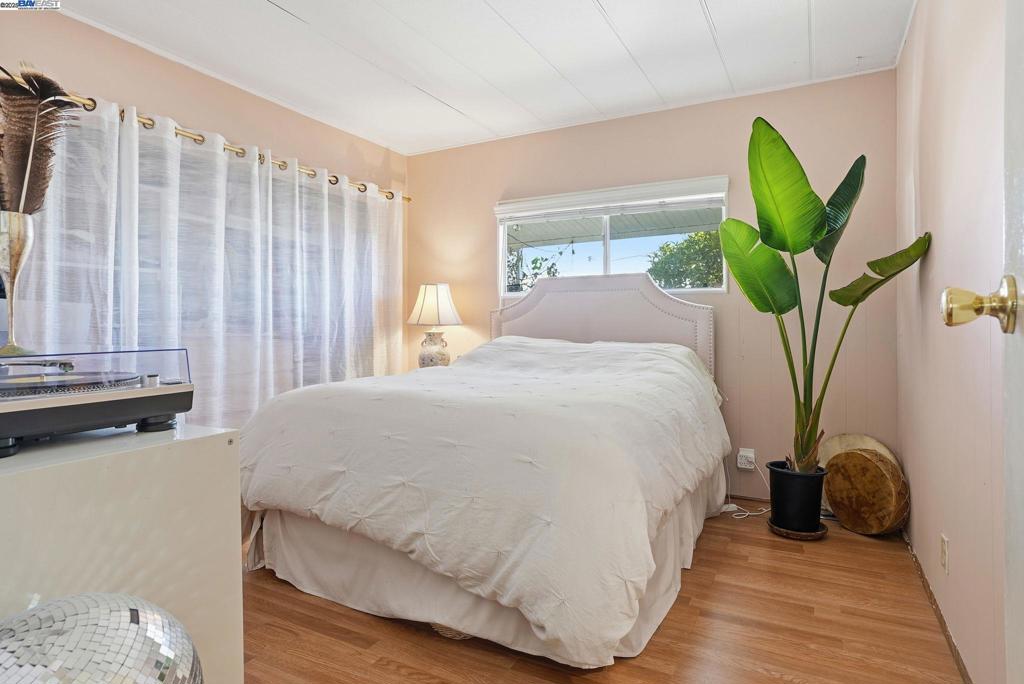 4141 Deep Creek Road Fremont, CA 94555 - Photo 24 of 54 a bedroom with a bed and a window