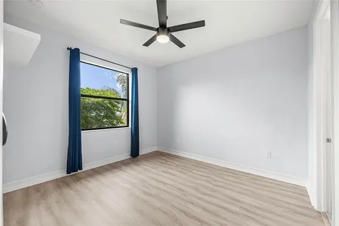 an aerial view of a house with a garden