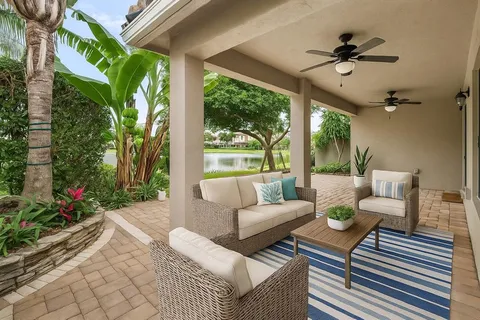 a view of kitchen with stainless steel appliances kitchen island granite countertop a large kitchen counter top and oven
