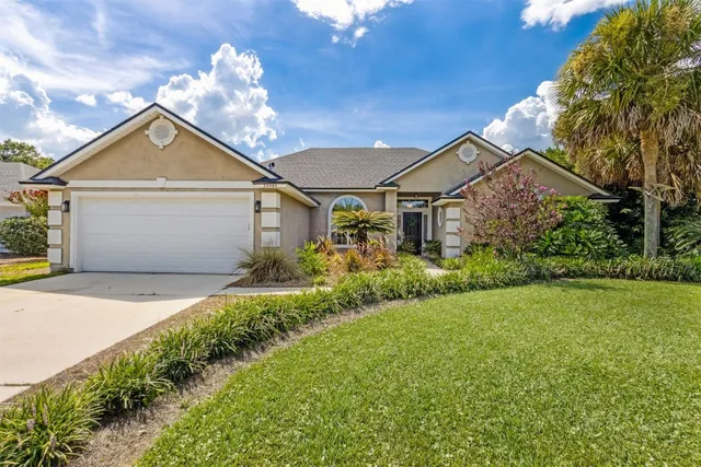 a view of a house with backyard porch and sitting area