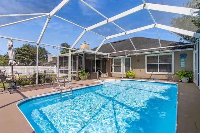 a living room with furniture a fireplace and a table