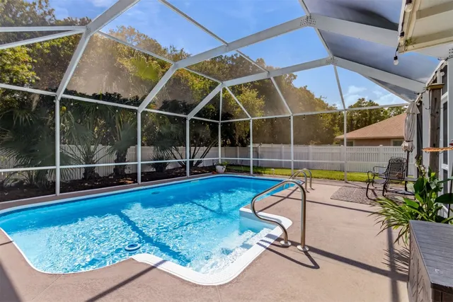 a view of a swimming pool with a patio