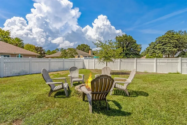a view of a park with swings and trees