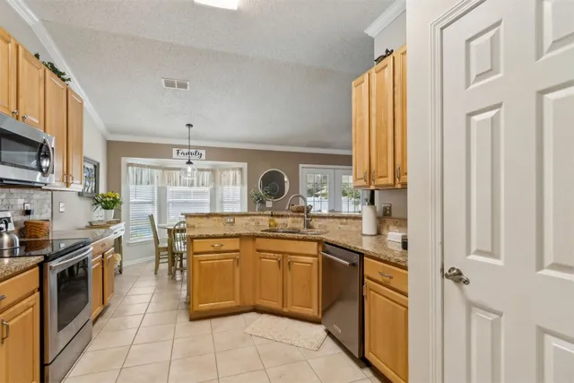 a white refrigerator freezer sitting in a kitchen