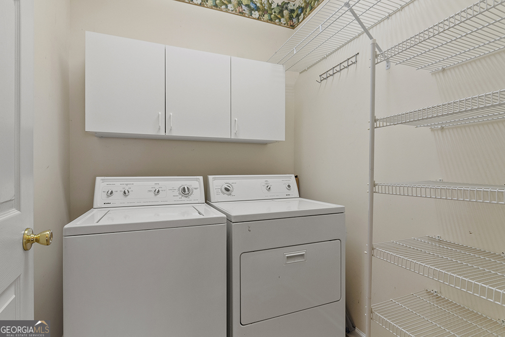 643 Millrun Court Macon, GA 31210 - Photo 18 of 32 a utility room with dryer and washer