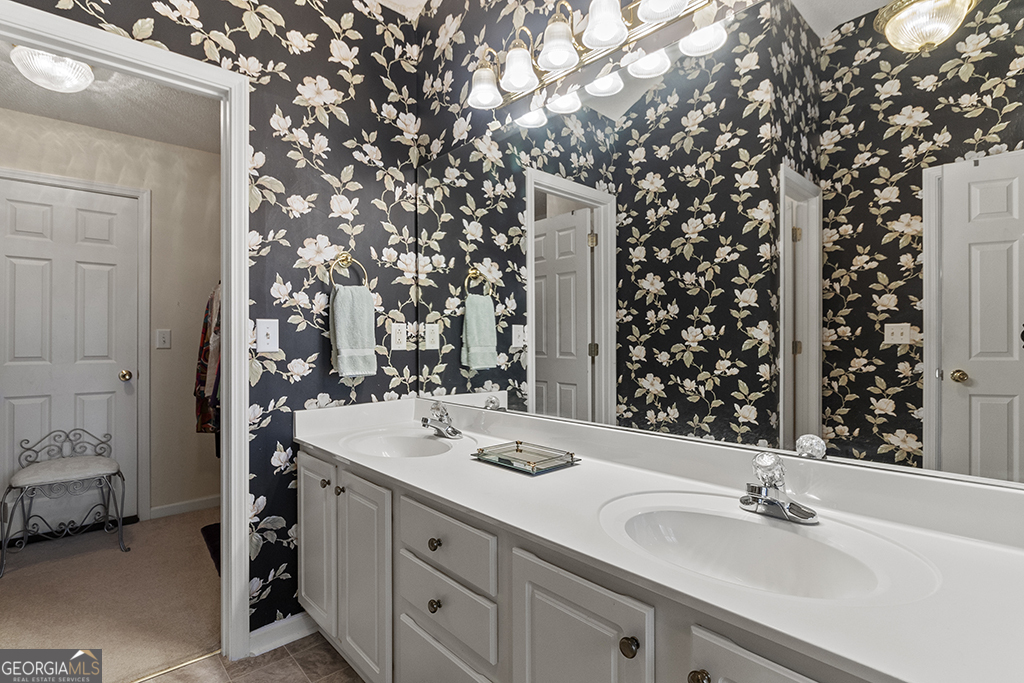 643 Millrun Court Macon, GA 31210 - Photo 23 of 32 a bathroom with a sink and a mirror