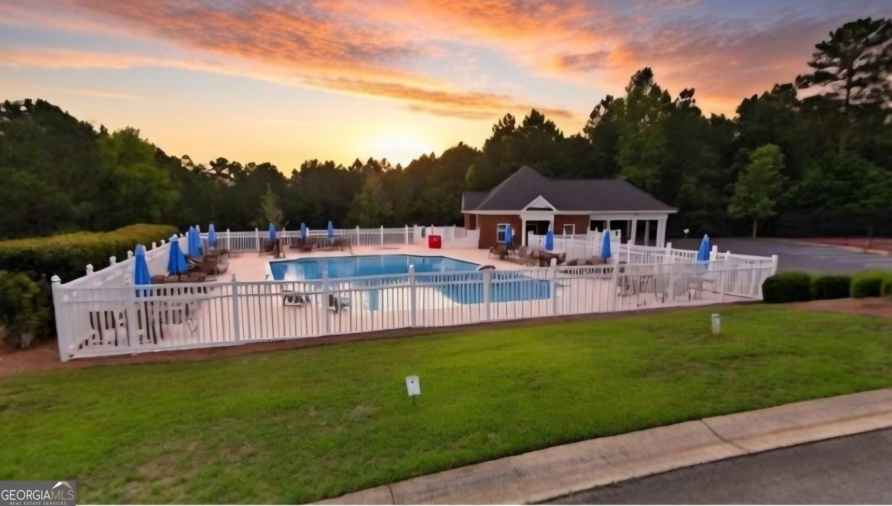 643 Millrun Court Macon, GA 31210 - Photo 31 of 32 a view of a house with pool and a yard