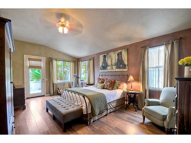 982 Merganser Lane Carlsbad, CA 92011 - Photo 11 of 20 Master Bedroom has ceiling fan, french door to backyard and ample room.