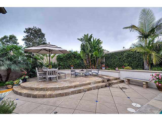 982 Merganser Lane Carlsbad, CA 92011 - Photo 15 of 20 Custom backyard has firepit, seating areas and lush landscaping through out.