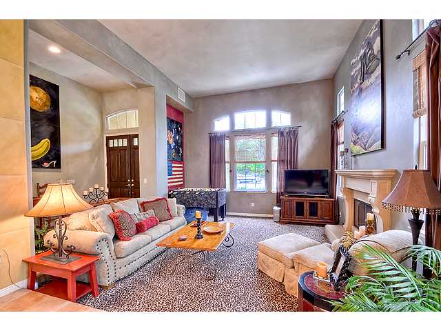 982 Merganser Lane Carlsbad, CA 92011 - Photo 4 of 20 Step Down living room with high ceilings, fireplace and clerestory windows.