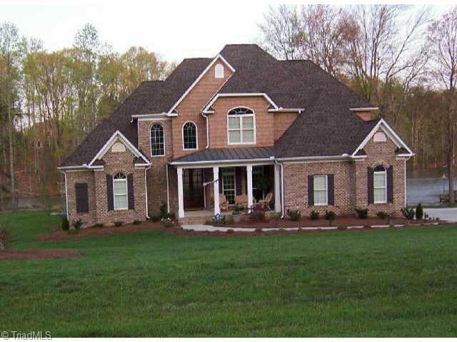 7079 Lanier Road Summerfield, NC 27358 - Photo 1 of 7 Exterior Front. On Lake
