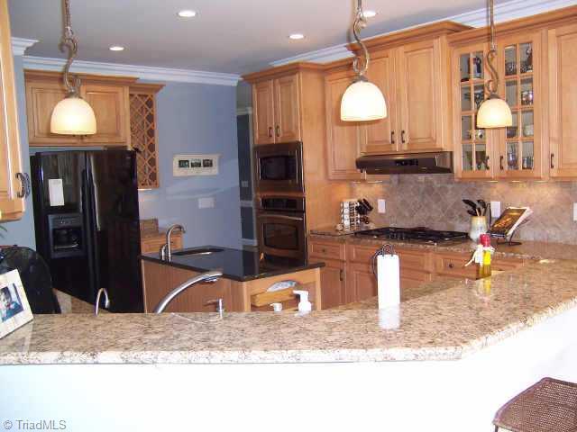 7079 Lanier Road Summerfield, NC 27358 - Photo 4 of 7 Other. Granite countertops with custom cabinets