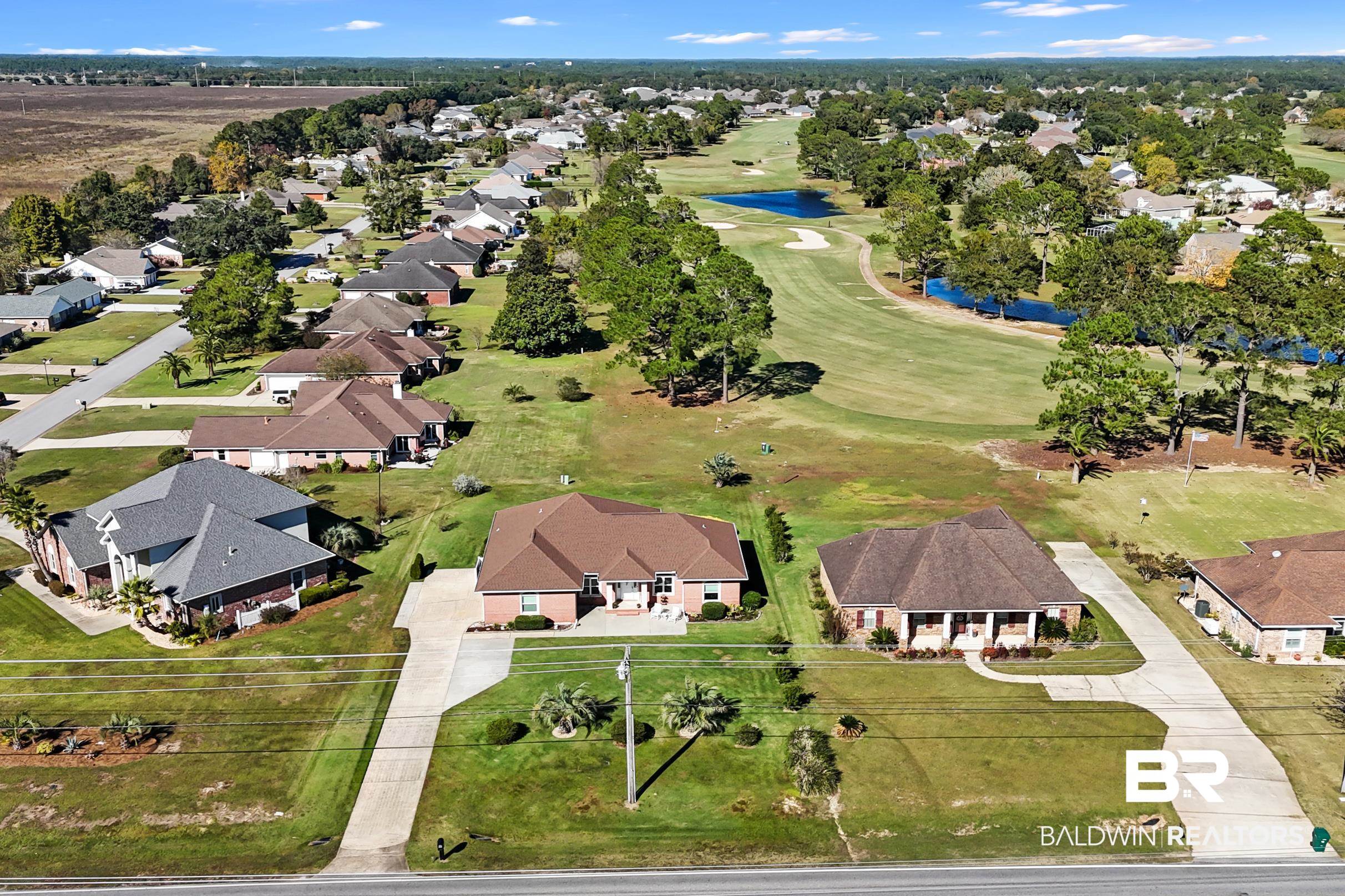 22355 East County Road 12 Foley, AL 36535 - Photo 3 of 54 View of property location with nearby suburban area, a nearby body of water, and a golf club