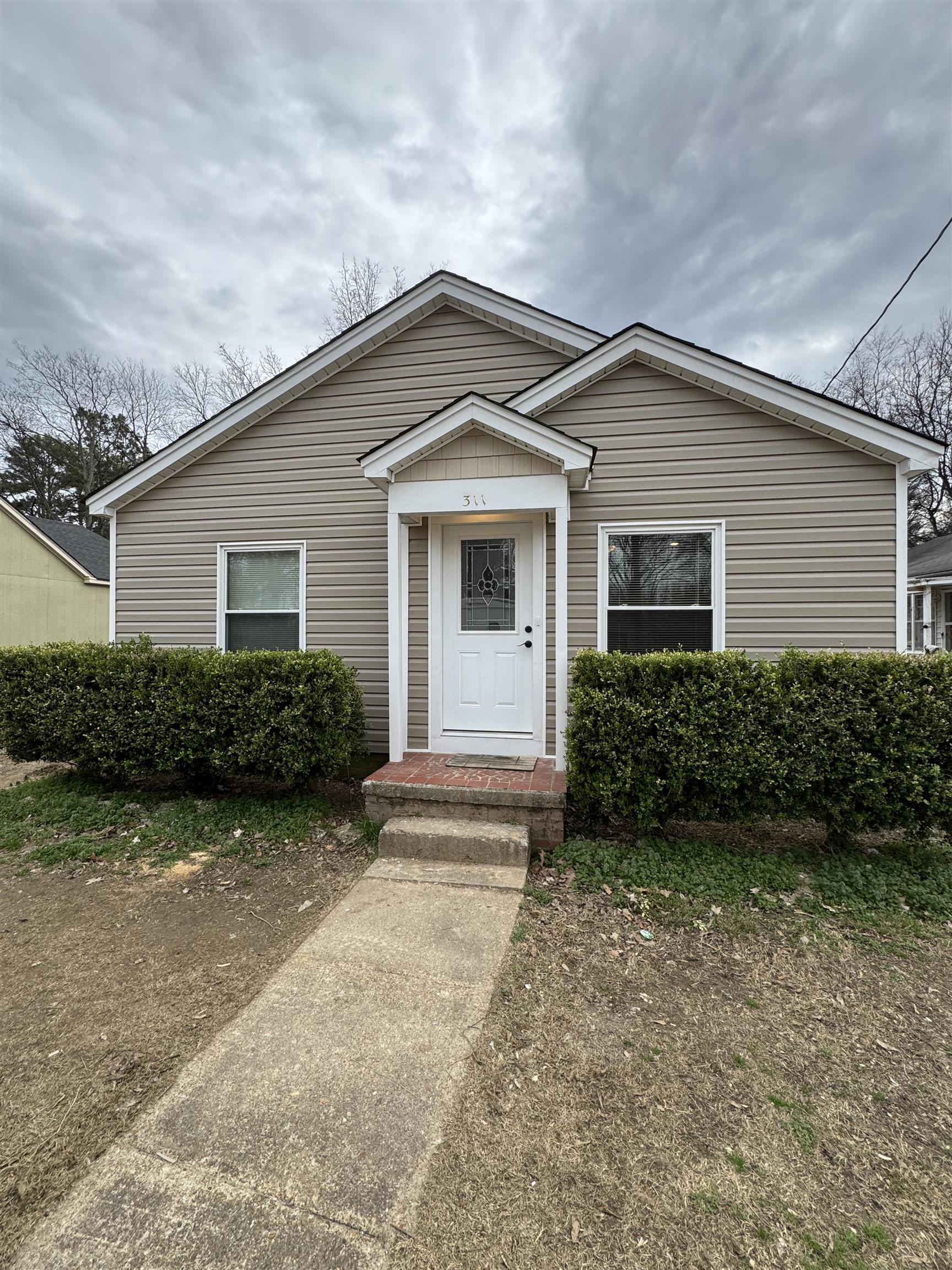 311 East Ripley Avenue Covington, TN 38019 - Photo 23 of 37 a view of outdoor space yard and garage