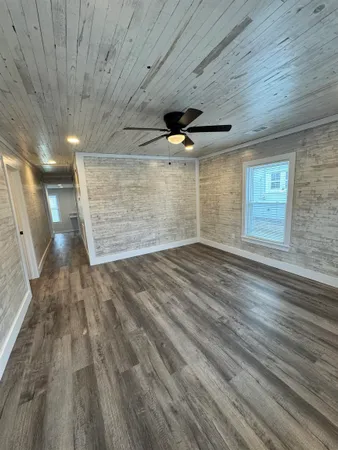 a kitchen with stainless steel appliances kitchen island granite countertop a sink refrigerator and microwave