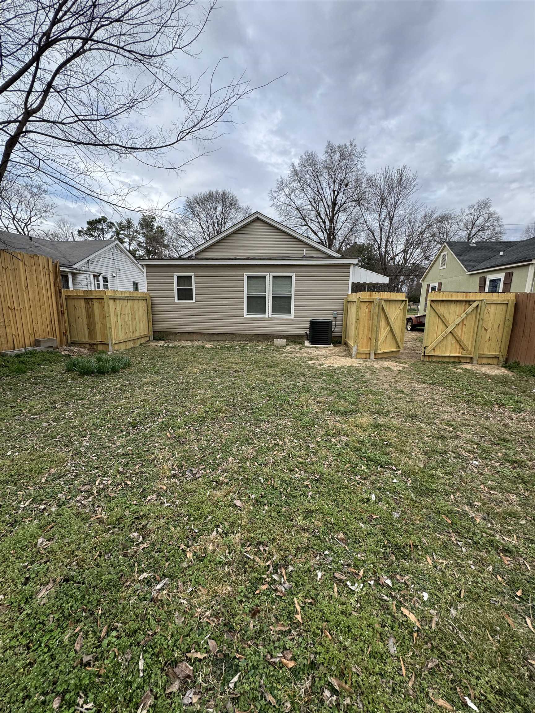 311 East Ripley Avenue Covington, TN 38019 - Photo 32 of 37 Back of property with a gate and a fenced backyard