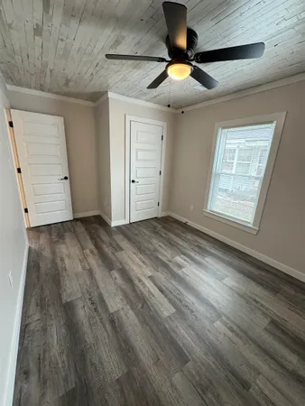 a view of kitchen with cabinets and wooden floor