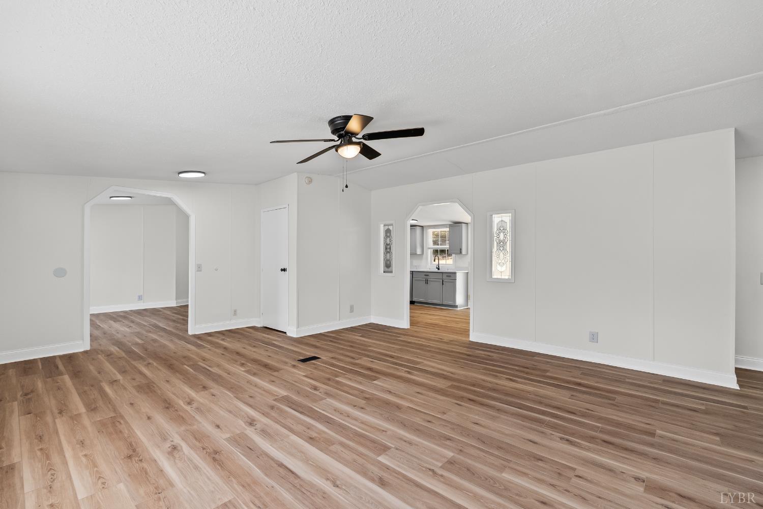 397 Dreaming Creek Road Spout Spring, VA 24538 - Photo 12 of 39 wooden floor in an empty room with a window