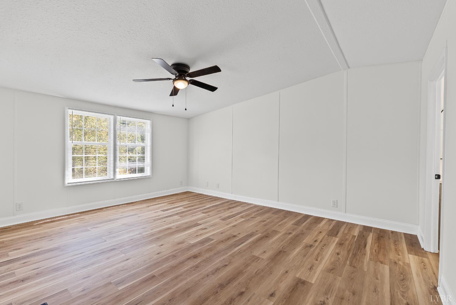397 Dreaming Creek Road Spout Spring, VA 24538 - Photo 15 of 39 wooden floor in an empty room with a window