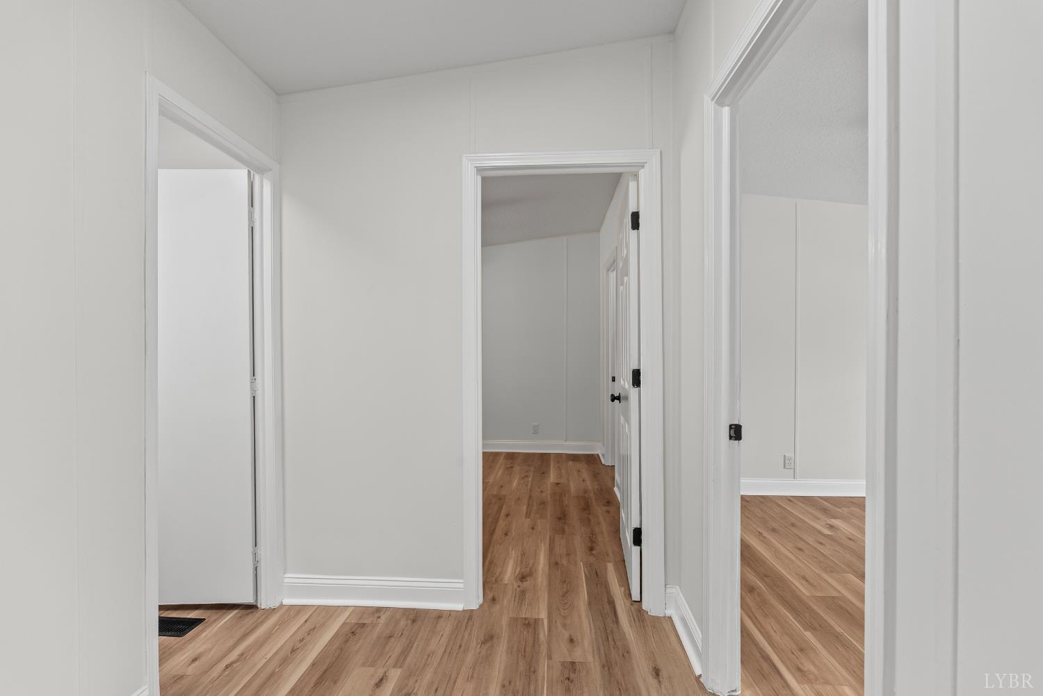 397 Dreaming Creek Road Spout Spring, VA 24538 - Photo 21 of 39 a view of a hallway with wooden floor