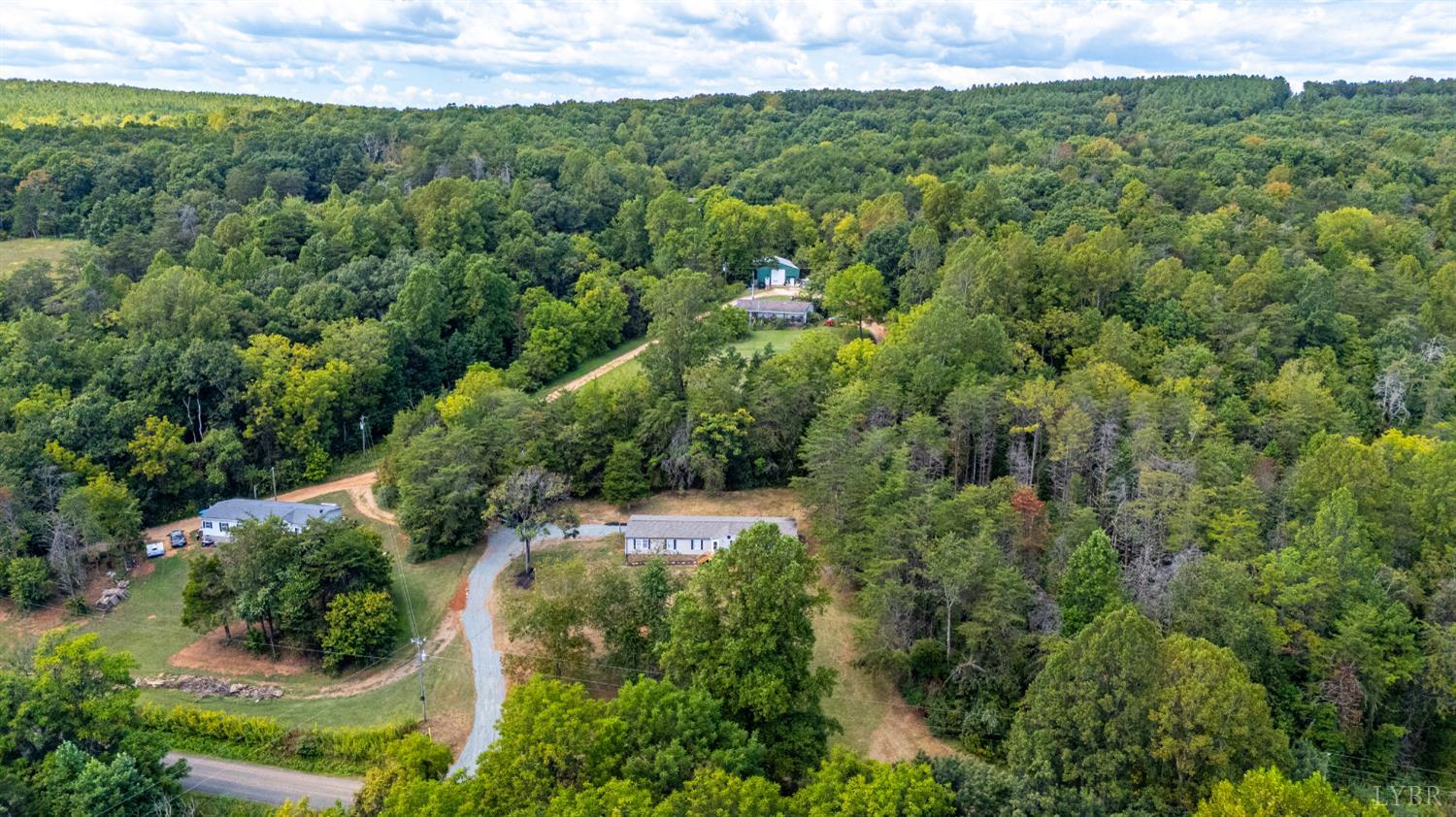 397 Dreaming Creek Road Spout Spring, VA 24538 - Photo 39 of 39 an aerial view of residential houses with outdoor space and trees