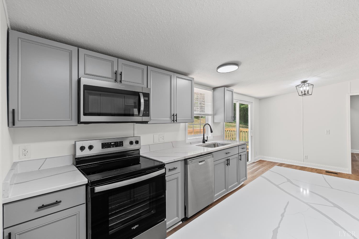 397 Dreaming Creek Road Spout Spring, VA 24538 - Photo 5 of 39 a kitchen with a sink and a stove top oven