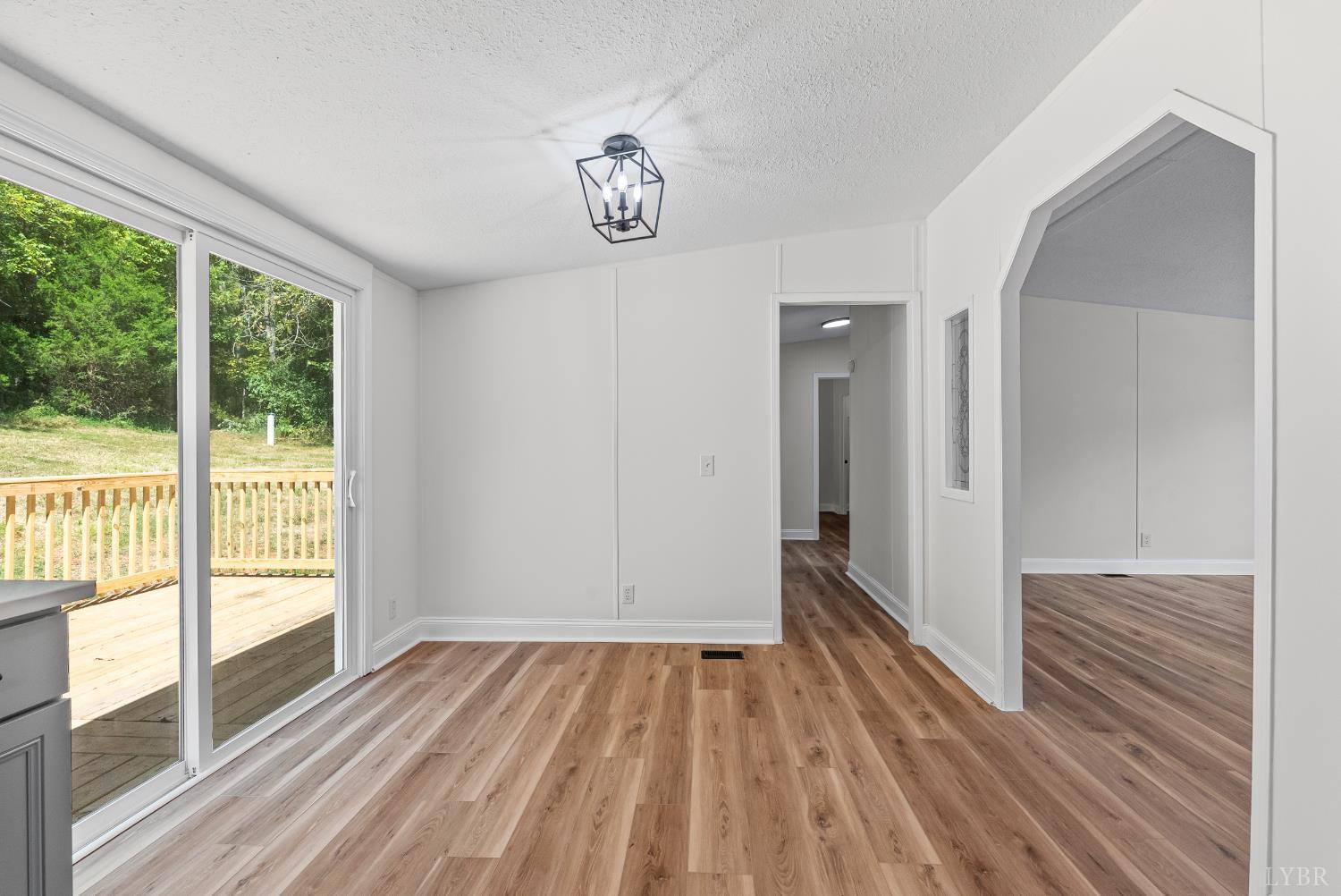 397 Dreaming Creek Road Spout Spring, VA 24538 - Photo 9 of 39 a view of a room with wooden floor fence and windows