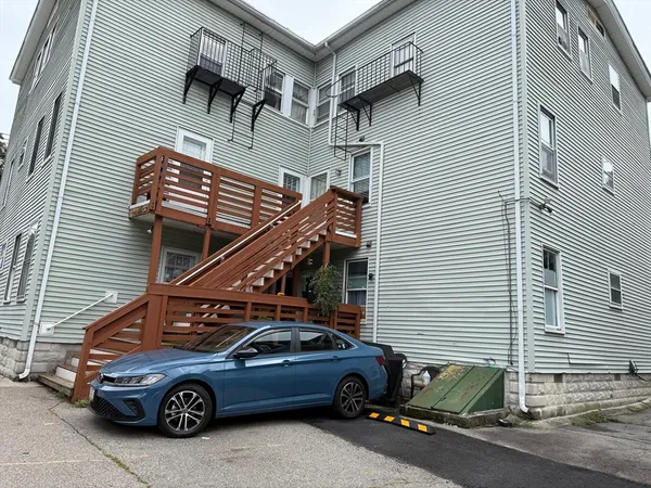 a car parked in front of a house