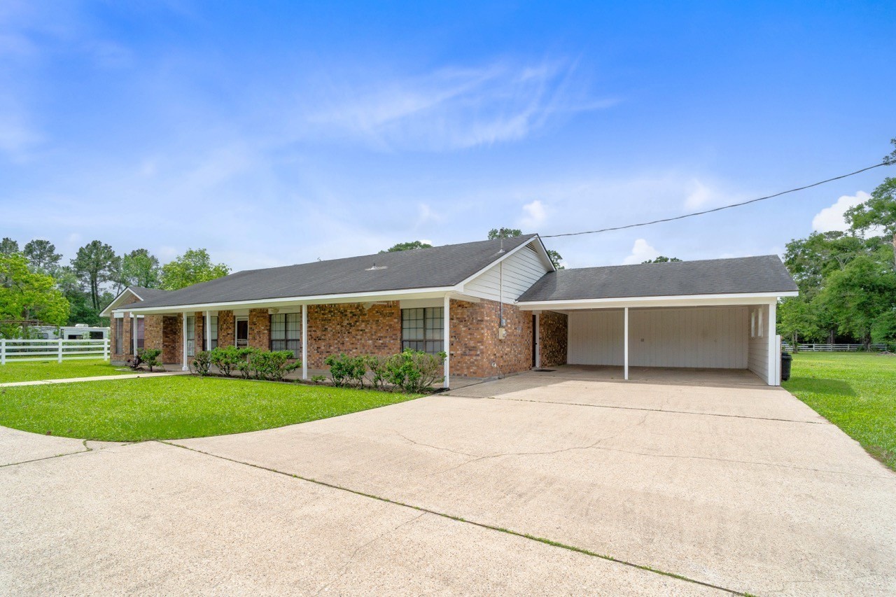 13180 Morgan Drive Splendora, TX 77372 - Photo 34 of 38 Park under the attached carport while having plenty of room for guest parking in the oversized, long circular driveway.